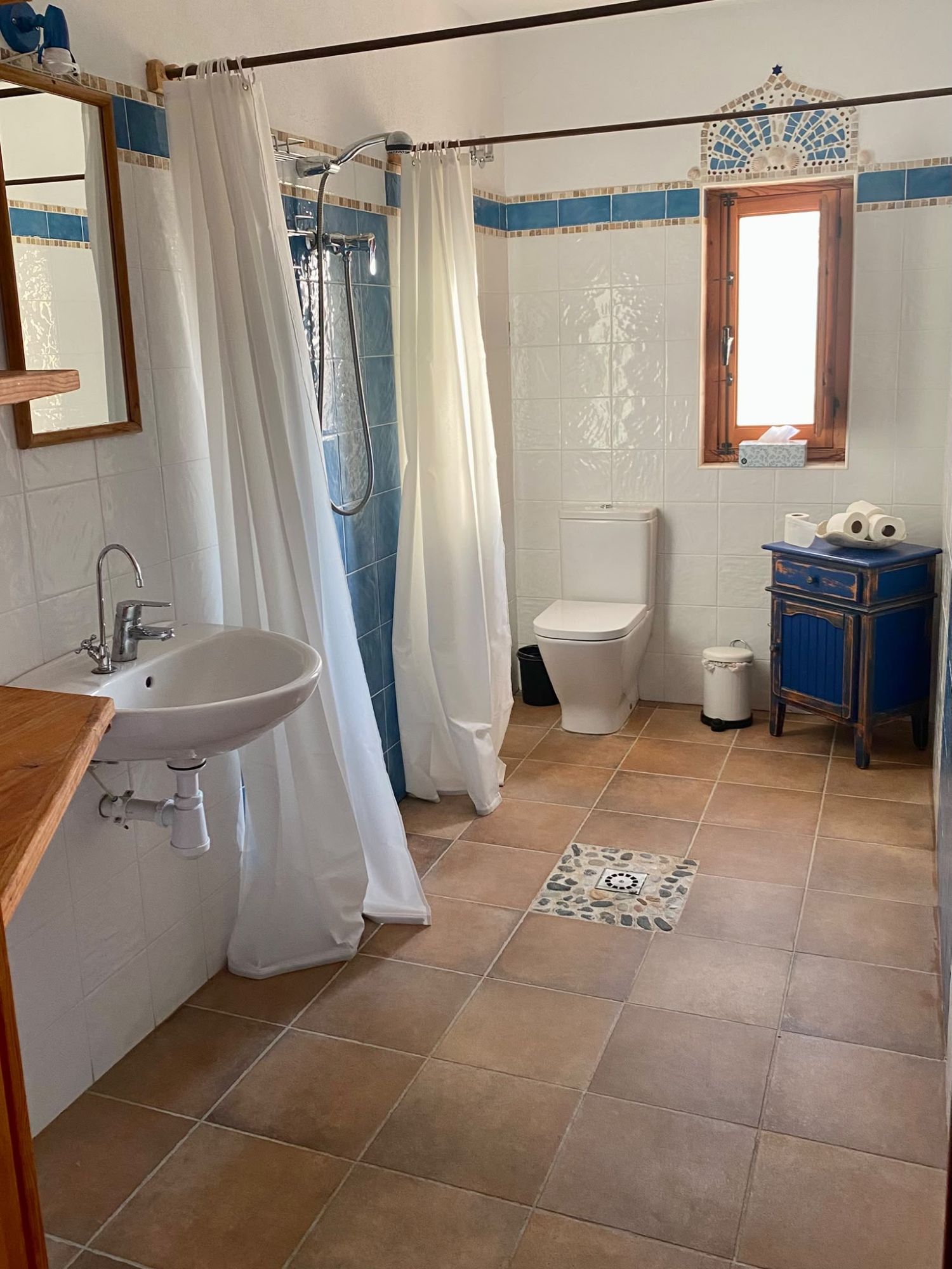 Tiled bathroom with walk-in shower